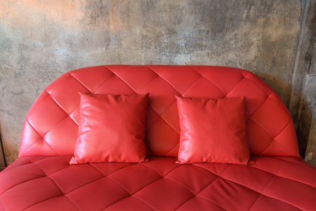 red sofa with  grunge backgroundの写真素材