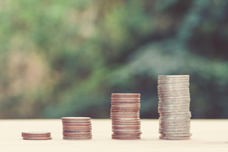 Business Finance and Money concept, Money coin stack growing graph with green bokeh background.vintage process styleの写真素材