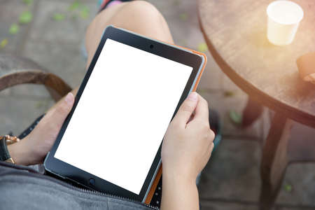 Hand of Asian girl playing Tabletの写真素材