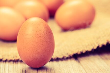fresh chicken eggs on wood table