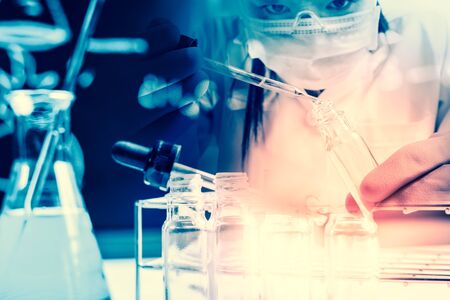 scientist with equipment and science experiments,Laboratory glassware containing chemical liquid,...