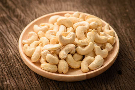 close up of cashew nut in wood dishの写真素材