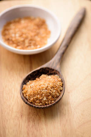 Raw Organic Cane Sugar in a wooden spoonの写真素材