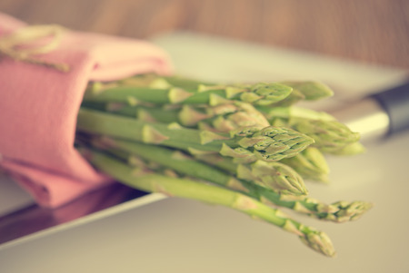 asparagus on chopping block in vintage tone styleの写真素材