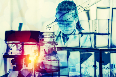 Double exposure of scientist with equipment and science experiments,science backgroundの写真素材