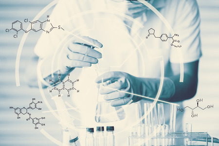 scientist with equipment and science experiments.with chemical equations