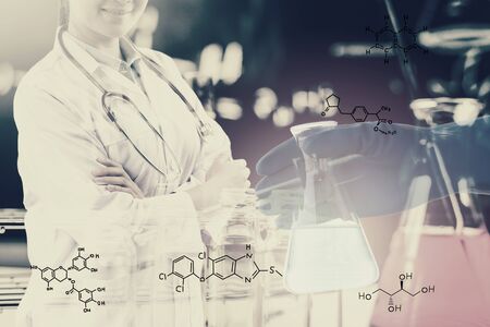 Double exposure of Scientists or doctor with Laboratory glassware containing chemical liquid, science research concept,vintage process styleの写真素材