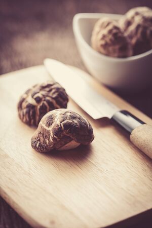 dried shiitake mushroom on wood block for food backgroundの写真素材