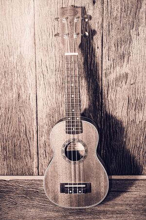 ukulele on old wooden ;vintage filtered style
