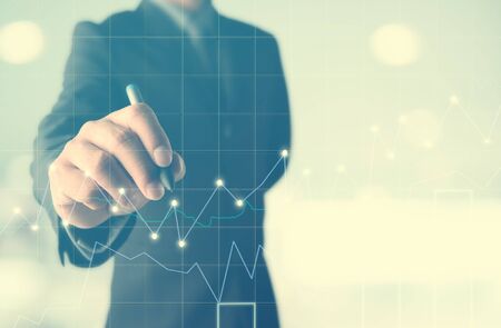 business man writing , Business Trading concept,Forex graph