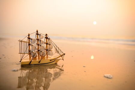 Sailing ship model on the beach, discovery concept.の写真素材