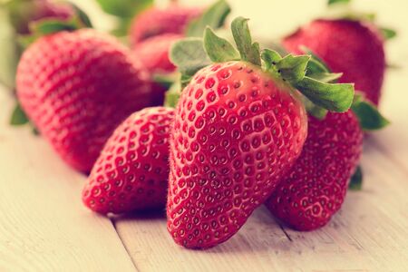 Fresh strawberries on white wood tableの写真素材