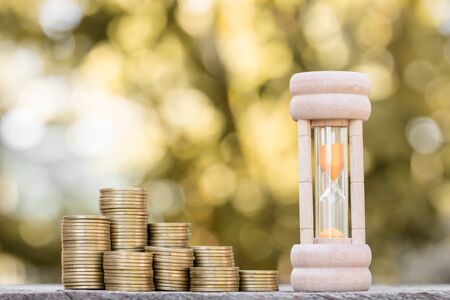 Finance and Money concept, Money coin stack growing graph with sunlight,investmentの写真素材