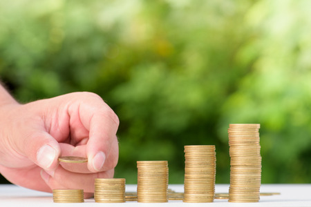 Money Gold coin Steps with green bokeh background ,Business Finance and Money concept,Hope of...