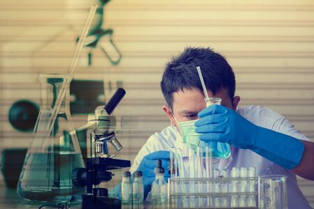 Chemist is analyzing sample in laboratory