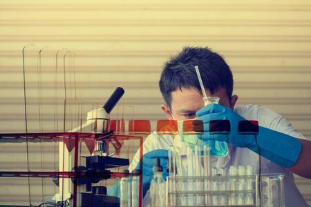 Chemist is analyzing sample in laboratory