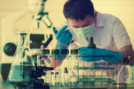 Chemist is analyzing sample in laboratoryの写真素材