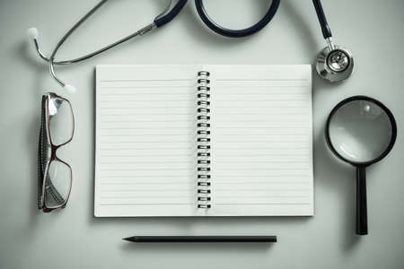 Notebook with blank spack and medical equipment  for medical concept backgroundの写真素材