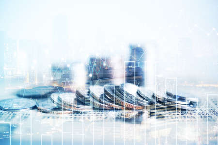 Double exposure of coins and city background for finance and banking conceptの写真素材