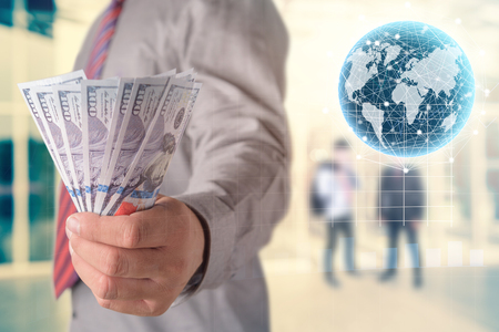 Businessman with money in hand, investment, success and profitable business conceptsの写真素材