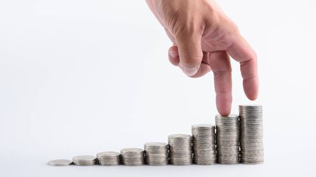 Hand with money stack step growing growth saving money, Concept finance business investmentの写真素材