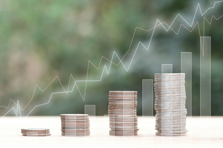 Business Finance and Money concept, Money coin stack growing graph with green bokeh background