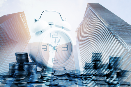 Double exposure of city and rows of coins for finance and banking concept,Business Finance and Money concept,Save money for prepare in the future.の写真素材