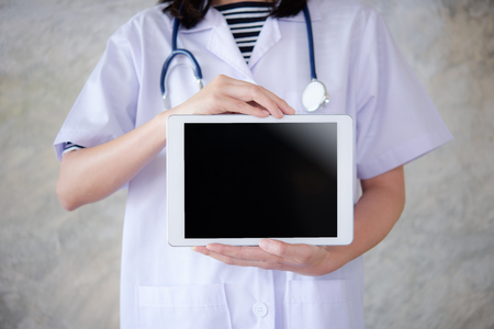 doctor holding blank digital tablet with empty screen.の写真素材