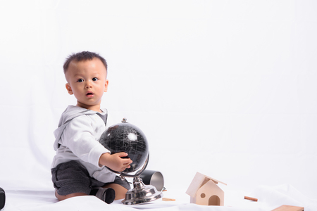 Asian Cute Boy Playing the Globe model simulation.の写真素材