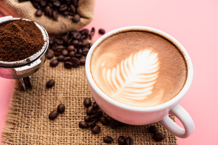 coffee latte art with coffee beansの写真素材