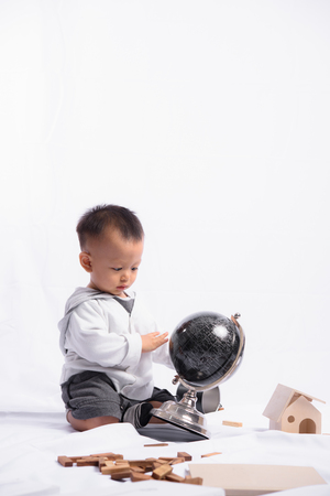 Asian Cute Boy Playing the Globe model simulation.の写真素材