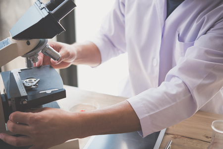 scientist Using the Microscope in lab.の写真素材