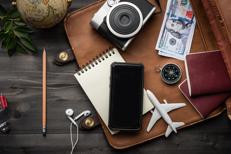 Travel accessories and costume on wooden floor,Travel concept.の写真素材