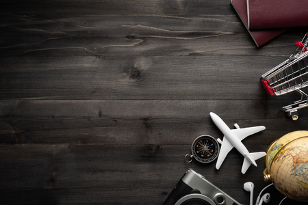 Travel accessories and costume on wooden floor,Travel concept.coppy space for text or design.の写真素材