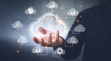 Big data analytics and business intelligence concept with chart and graph icons on a digital screen interface and a businessman in backgroundの写真素材