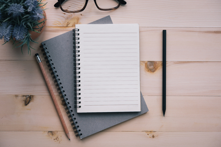 Notebook Blank notebook with pencil on wooden background.の写真素材