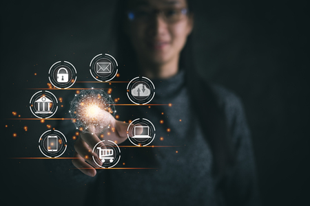 Digital marketing. Businesswoman touching global circle interface payment online shopping and icon customer network connection on virtual screen. Data exchanges. Business innovation technology conceptの写真素材