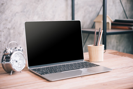 computer notebook on wood tableの写真素材