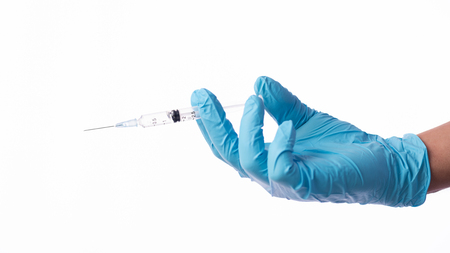 Hand with vaccine on white background.の写真素材