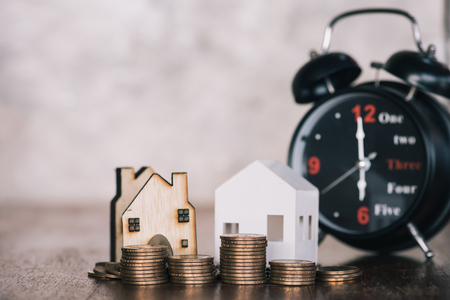 stacking dollars coins with a house model.save and investment for buy house concept .for the future.の写真素材
