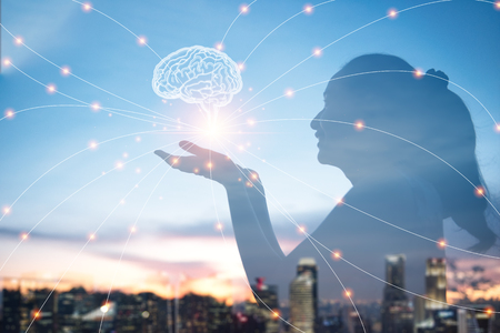 woman hands holding brain with network connections, innovative technology in science and communication conceptの写真素材