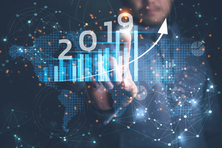2019 New year planning business and financial concept. Businessman touching virtual screen on growth graph chart and data, business strategy, banking and investment, digital marketing and payment.の写真素材