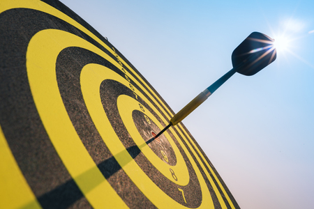 Bullseye is a target of business. Dart is an opportunity and Dartboard is the target and goal. So both of that represent a challenge in business marketing as concept.の写真素材