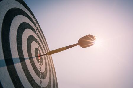 Bullseye is a target of business. Dart is an opportunity and Dartboard is the target and goal. So both of that represent a challenge in business marketing as concept.の写真素材