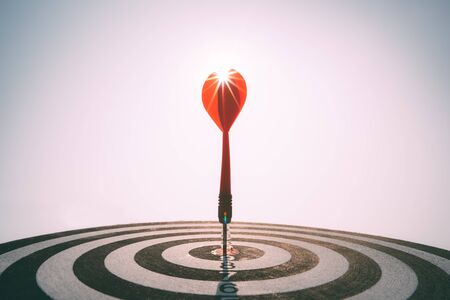 Bullseye is a target of business. Dart is an opportunity and Dartboard is the target and goal. So both of that represent a challenge in business marketing as concept.の写真素材