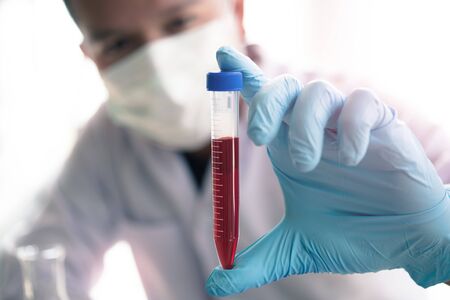 technician of health with blood tubes in the clinical lab for analytical , Medical, pharmaceutical and scientific research and development concept.の写真素材