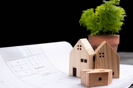 Small three wooden houses with modern design and construction drawing for home loans concept.の写真素材