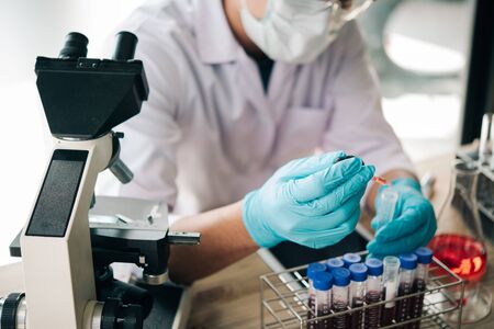Scientists are dripping liquid into the test tube.Research in lab Concepts.の写真素材
