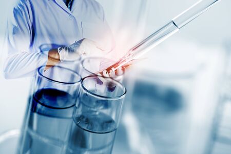 double exposure scientists and scientific equipment In the laboratory,Laboratory research concept.science background.Scientists use tablets.の写真素材