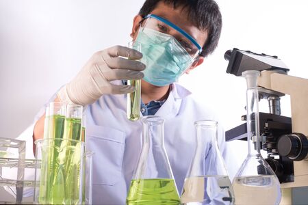 scientist with equipment and science experiments ,Laboratory glassware containing chemical liquid, science research background.の写真素材